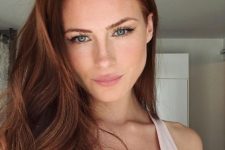 lovely long auburn hair with highlights and a lot of volume is fantastic, it accents the face and the eyes