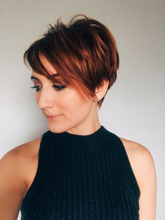 messy and bold long pixie haircut done in auburn, with layers and side bangs is a stunning idea for the fall