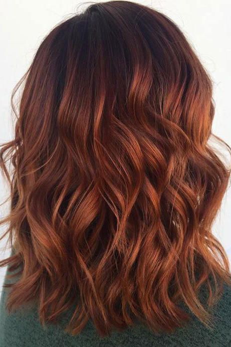 shoulder-length auburn hair with a shadow root, with volume and waves, is a stunning idea to rock in the fall