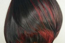 02 a black short bob with red peekaboo highlights for a passionate and bright look