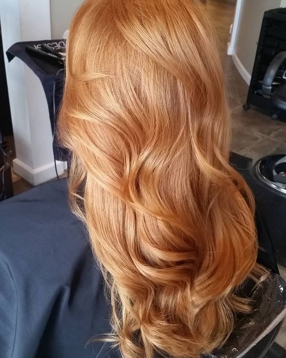 gorgeous long strawberry blonde hair with waves looks fantastic and the color play is beautiful