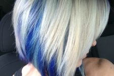 04 a blonde angled bob with electric blue peekaboo highlights for a fashionable touch
