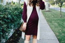 04 a plum-colored sweater dress with a creamy long waistcoat, creamy tall boots and a leopard bag