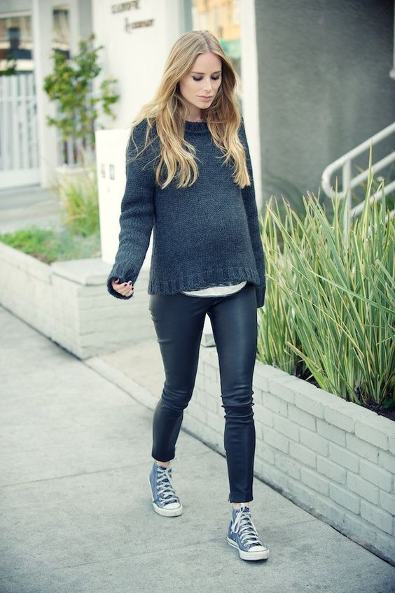 black leather pants, a white tee, a black sweater, navy sneakers for a touch of rock