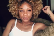 12 natural Afro curls in soft blonde with a darker root for a subtle look