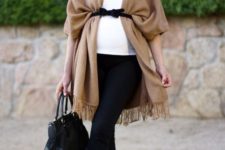 14 black pants, a white top, a beige coverup, a black bag and printed shoes for a stylish and comfortable look