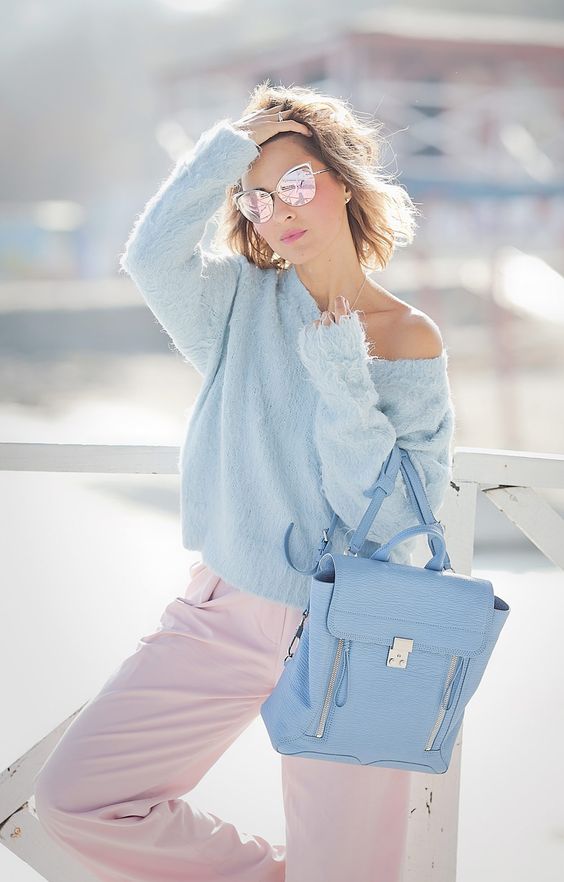 blush pants, a powder blue one shoulder sweater and a matching pastel bag for fall