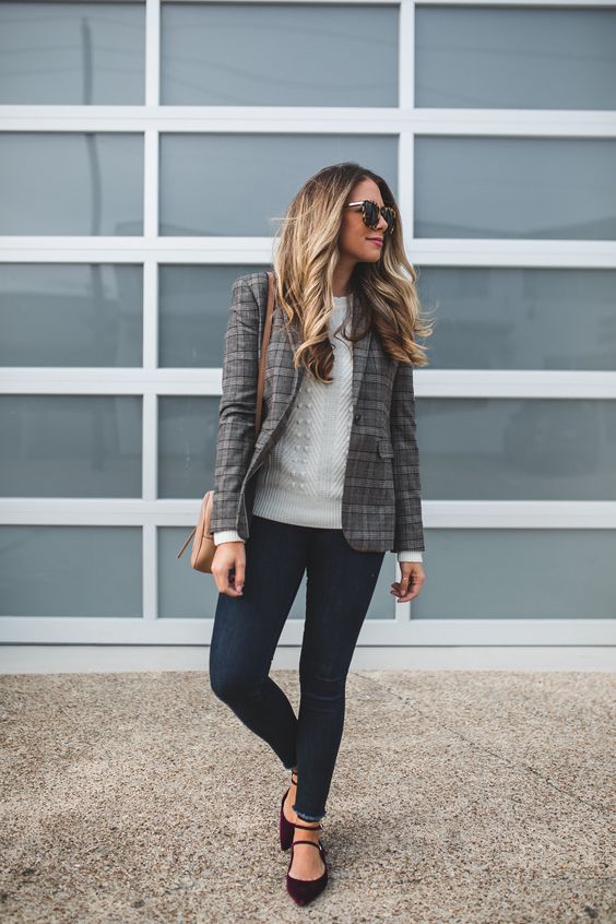 navy skinnies, a white sweater, a plaid blazer, plum-colored flats and a neutral bag