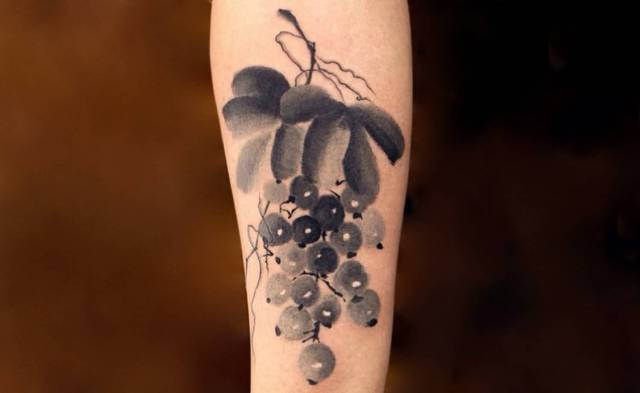 Black and gray tattoo on the forearm