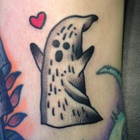 Black and white ghost and red heart tattoo