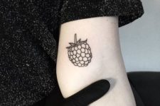 Black-contour berry tattoo design