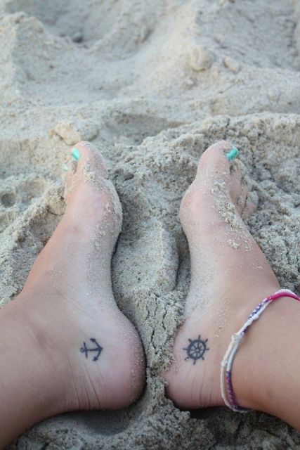 Black-contour tattoos on the feet