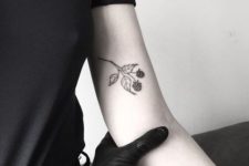 Black raspberry tattoo on the hand