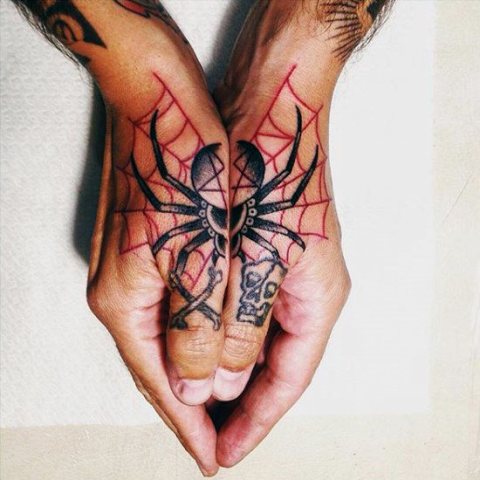 Black spider and red web tattoo on the both hands