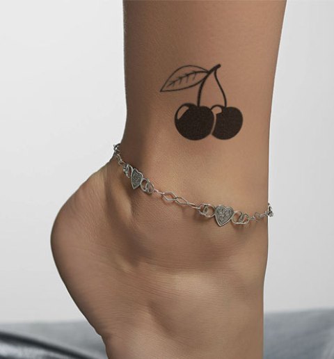 Black tattoo on the ankle