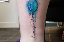 Blue watercolor balloon tattoo on the ankle