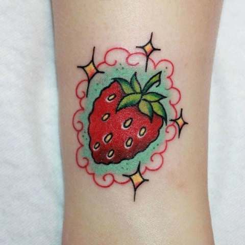 Cartoon strawberry tattoo