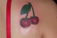 Classic cherry tattoo design on the shoulder