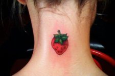 Cute strawberry tattoo on the neck
