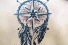 Dreamcatcher and compass tattoo on the back