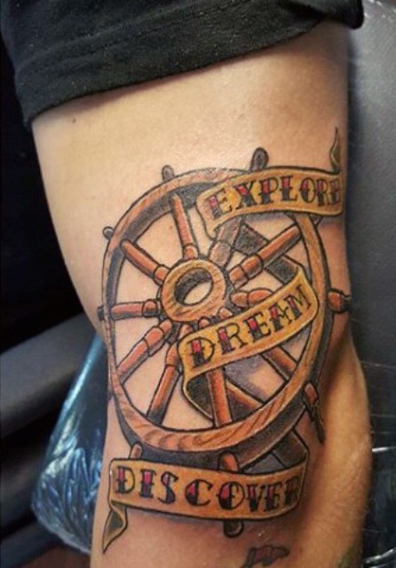 Explore, dream, discover tattoo on the leg