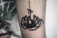 Funny cartoon spider tattoo on the hand