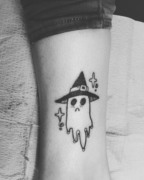 Ghost and hat tattoo on the leg