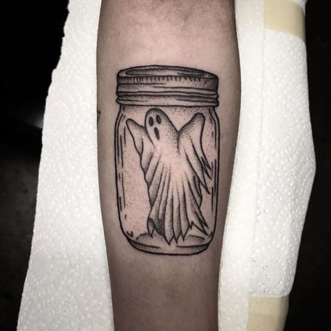 Ghost in jar tattoo on the arm
