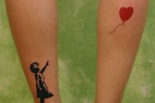 Girl with a red heart shaped balloon tattoo on the both legs