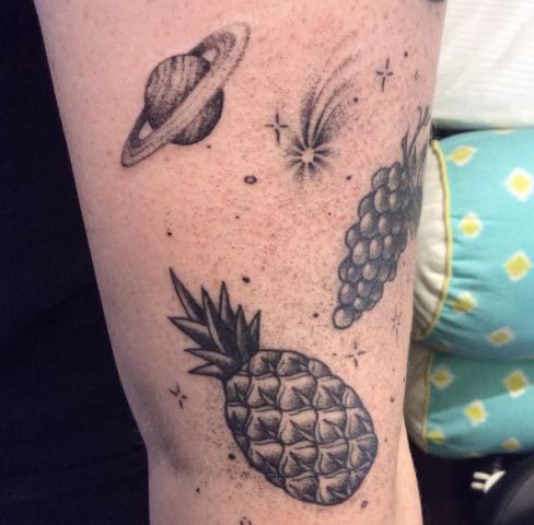 Grapes, planet and pineapple tattoos
