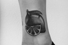 Lemon and slice tattoo on the ankle