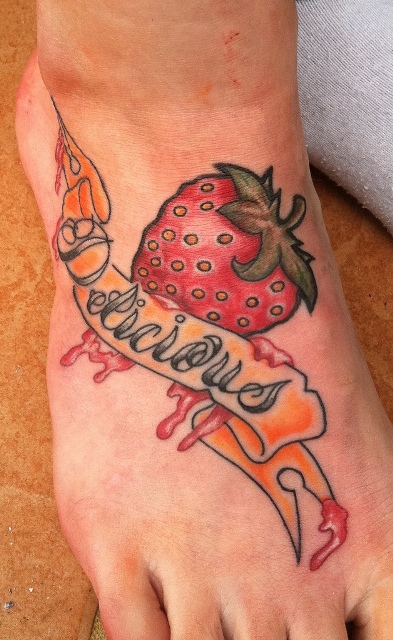 Melting strawberry tattoo on the foot