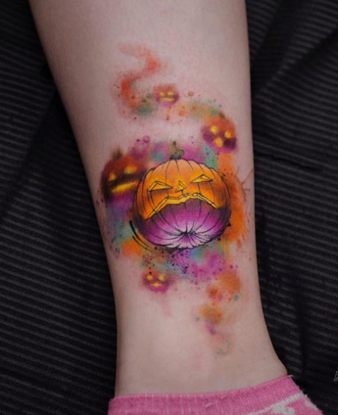 Orange and purple pumpkin tattoo