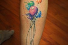 Orange, pink, purple, green and blue balloons tattoo