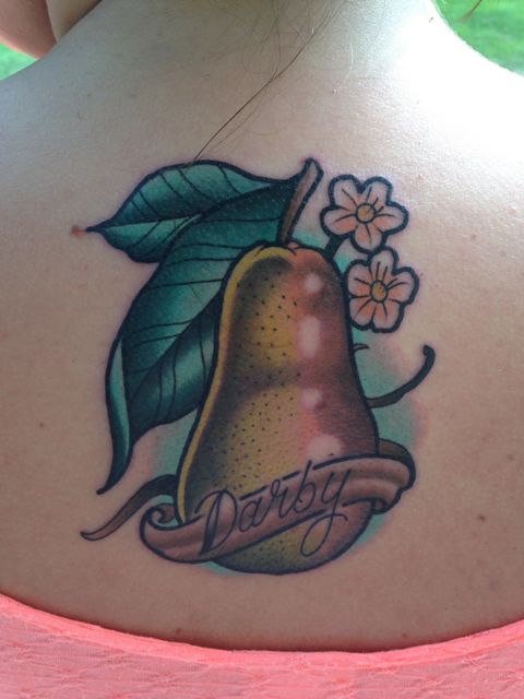 Pear, flowers and leaves tattoo on the back