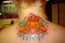 Several pumpkins tattoo on the neck