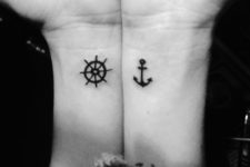 Tiny ship wheel tattoo on the wrist