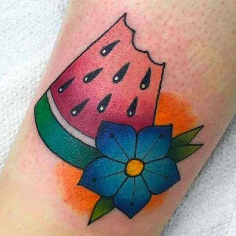 Watermelon slice and blue flower tattoo