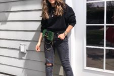 With black sweater, gray distressed jeans and black boots