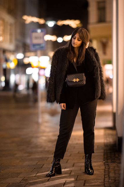 With fur coat, black jacket, black crop trousers and patent leather boots