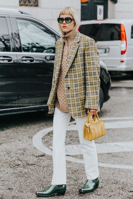 With loose sweater, checked long jacket, white trousers and small bag