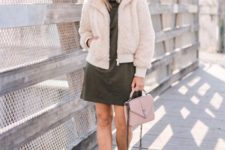 With olive green dress, pale pink bag and suede boots