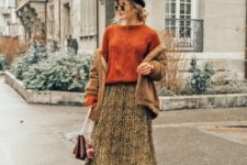 With orange sweater, cap, pleated skirt, sock boots and bag
