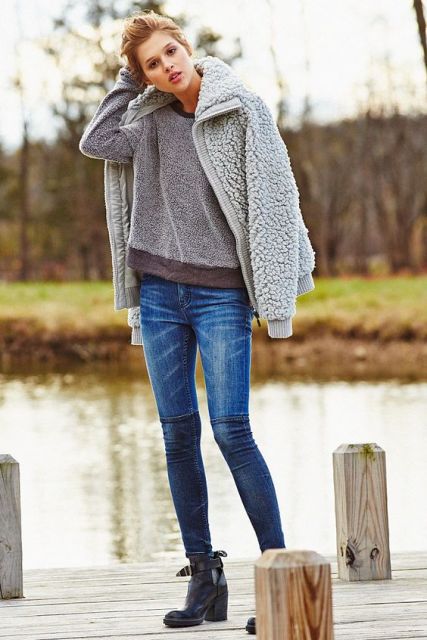 With sweatshirt, skinny jeans and heeled boots