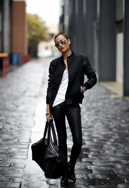 With white t-shirt, leather skinny pants, big bag and ankle boots