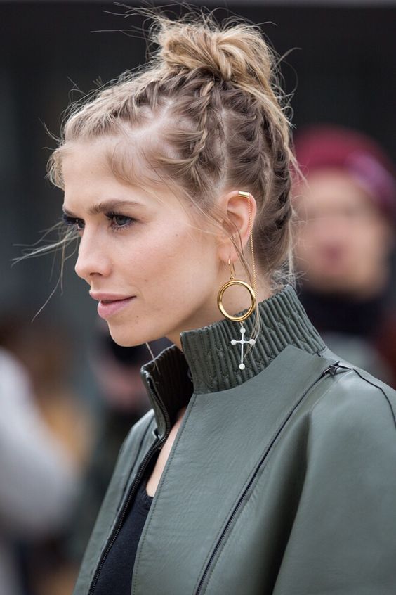 a braided updo on short hair that consists of several braids ending in a top knot is a cool and very eye-catchy idea