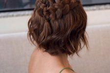 a half updo with a loose braided halo and waves down is a cool idea for a boho look