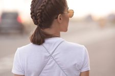 a lovely hairstyle with two braids ending up in a single ponytail is a cool solution that rocks
