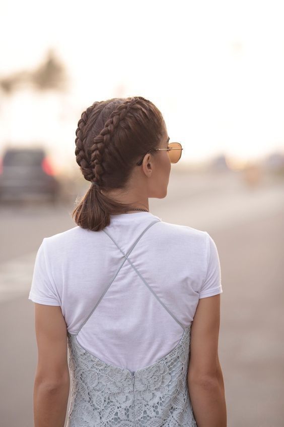 a lovely hairstyle with two braids ending up in a single ponytail is a cool solution that rocks
