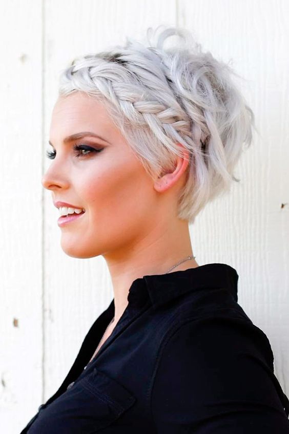 a platinum blonde pixie haircut with a single side braid looks pretty and textural and brings interest